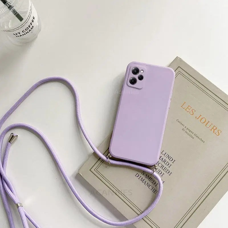 a purple phone case with a strap on top of it