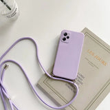 a purple phone case with a strap on top of it
