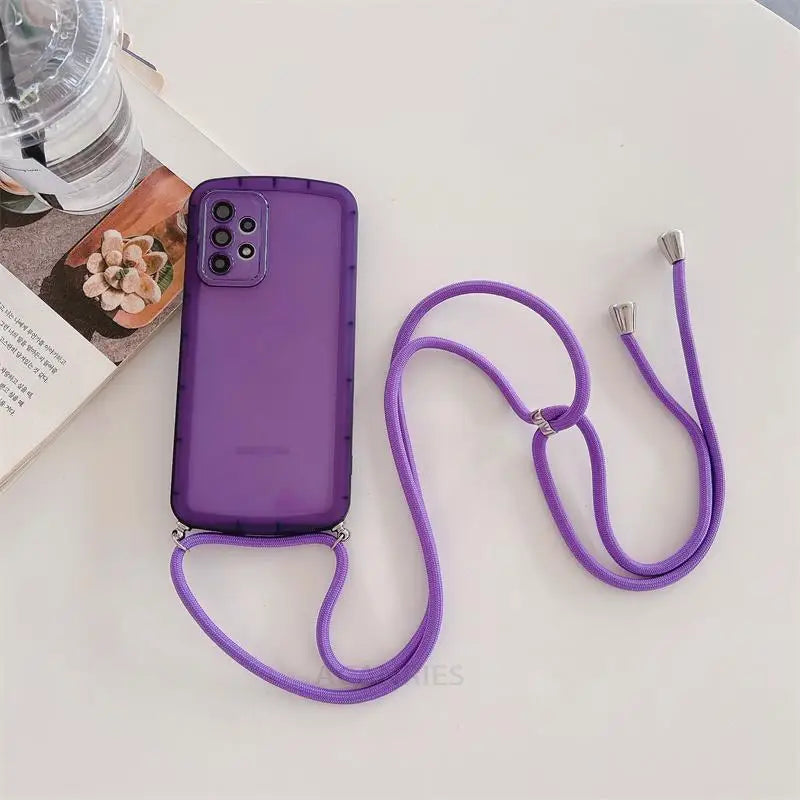 purple phone with a cord attached to it next to a book