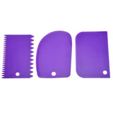 purple plastic combs with a purple handle and a purple blade