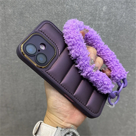 Purple quilted phone case with fuzzy handle.