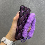 Purple quilted phone case with fluffy strap.