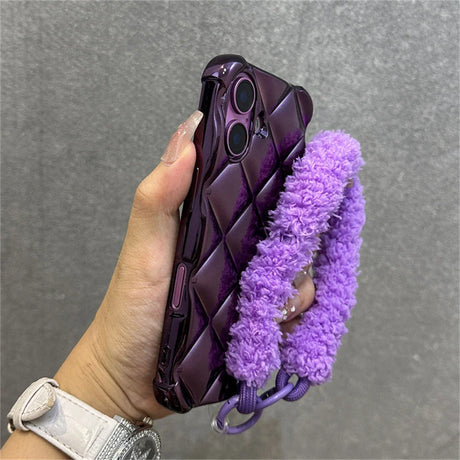 Purple quilted phone case with fluffy strap.