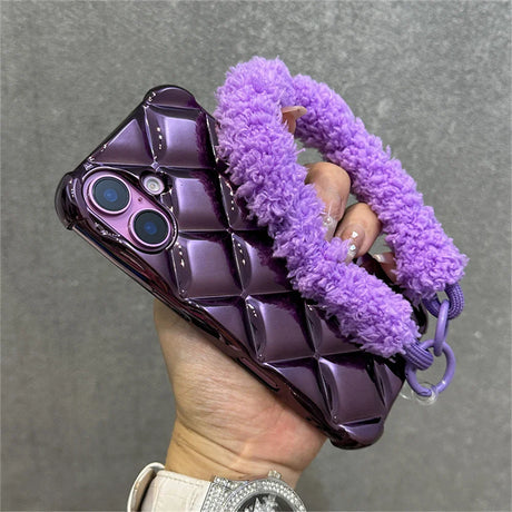 Purple quilted phone case with fuzzy strap.