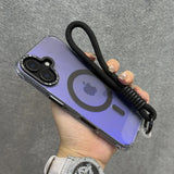 Purple smartphone with a clear protective case, a black camera protector, a magnetic charging ring, and an attached black wrist strap.