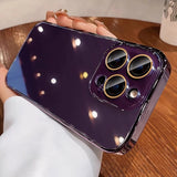 Purple smartphone with a gold-trimmed triple camera system.