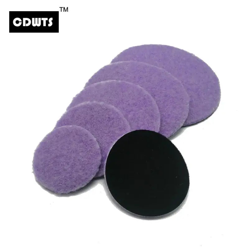 a purple sponge with a black circle on top