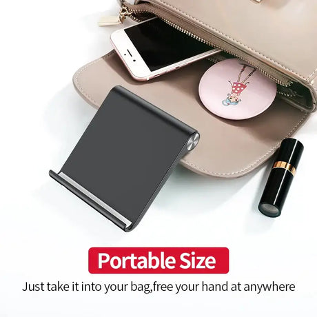 There is a purse with a phone and a mirror on it