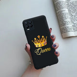 a woman holding a phone case with the word queen on it