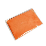 there is a orange cloth on a white surface