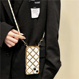 Quilted phone case with chain strap.