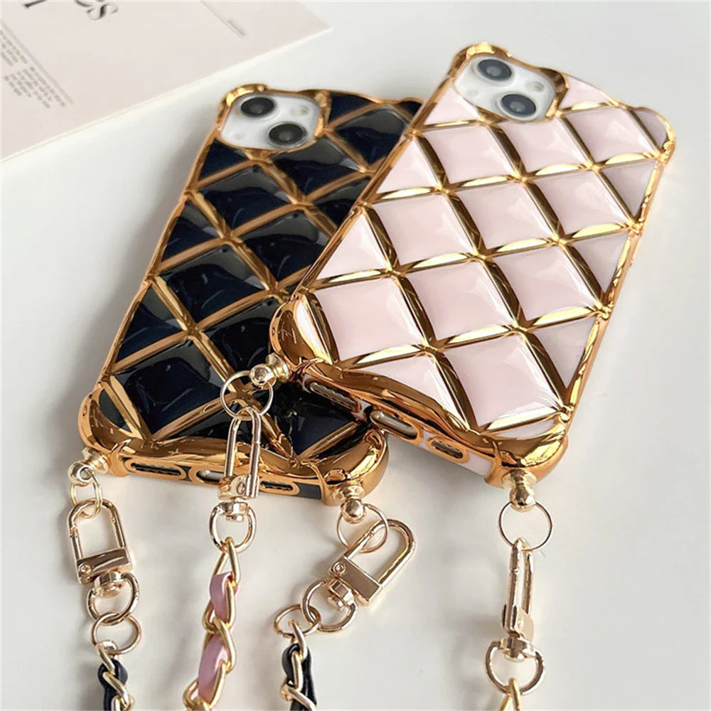 Quilted phone cases with gold trim and chain straps.