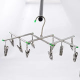 a metal rack with several hooks hanging from it
