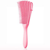 a pink brush with a handle