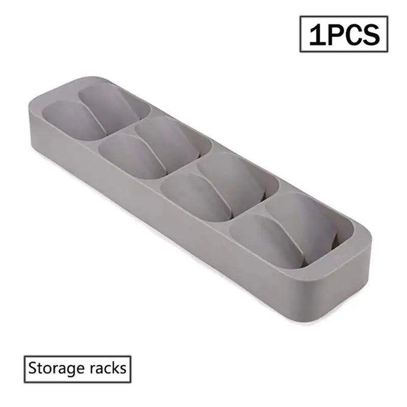 a gray plastic storage box with three compartments