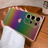Rainbow glitter phone case with a heart cutout and camera protection.