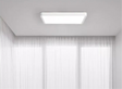 Rectangular ceiling light fixture with a white frame.