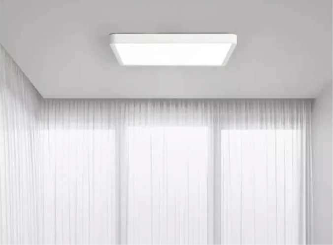 Rectangular ceiling light fixture with a white frame.