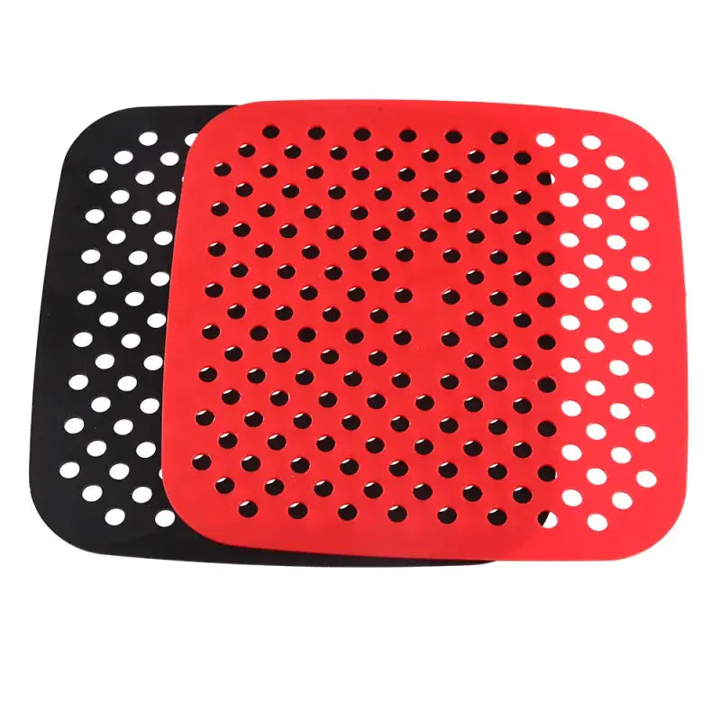 a red and black rubber mat with holes