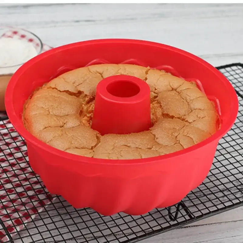 a red cake pan with a cake in it