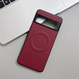 Red carbon fiber phone case with a camera cutout and a circular magnetic ring.
