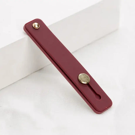 A red door handle on a white background