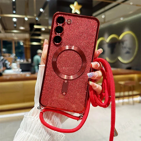 Red glittery smartphone case with a ring holder and star charm.