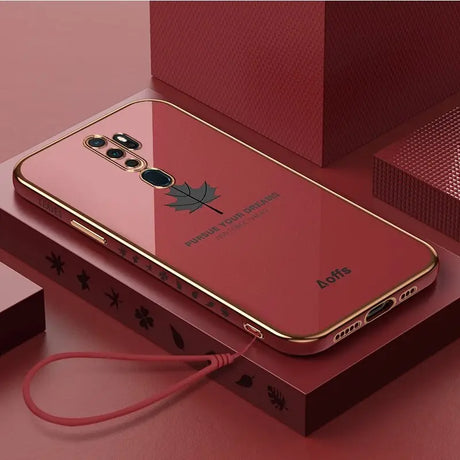 a red iphone case with a gold frame and a red phone case