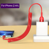 a red phone charging station with a phone and a charger