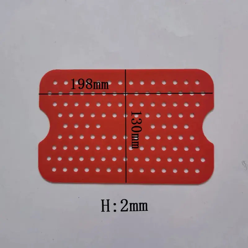 a red plastic card with white dots