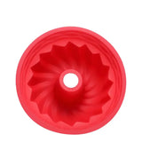 a red plastic cup with a hole in the middle