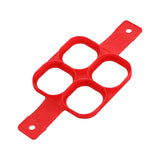 a red plastic cutter with four holes