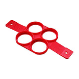 a red plastic cutter with four holes