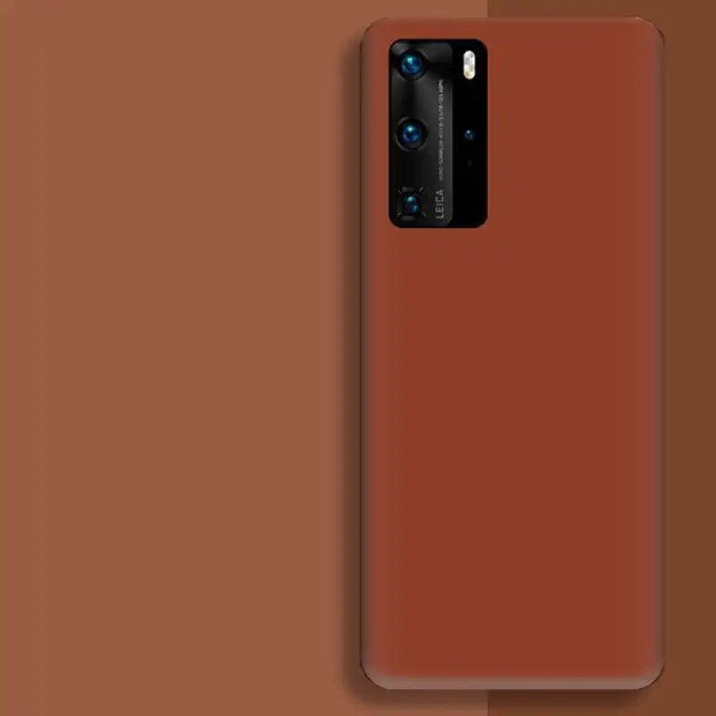 The back of a red samsung phone with a brown background