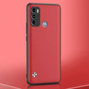 Red smartphone with a black protective case, triple camera system, and a circular button at the bottom.