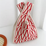 a red and white bag sitting on a table