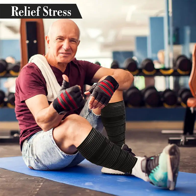 a man sitting on the ground with his legs crossed