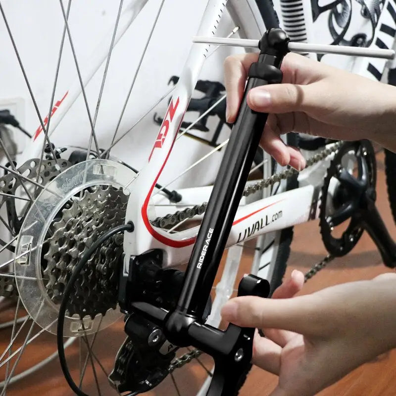 a person is fixing a bicycle wheel