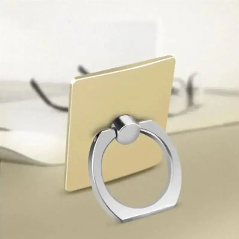 a ring on a table with a computer in the background
