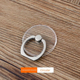 a ring with a heart inside on a wooden table