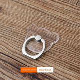 a cat shaped ring on a wooden table