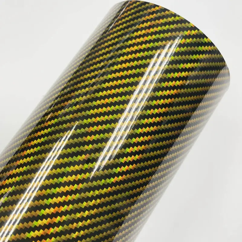 a close up of a roll of black and green carbon fiber