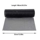 a roll of black mesh mesh fabric on a white background