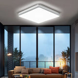 a living room with a couch and a ceiling light