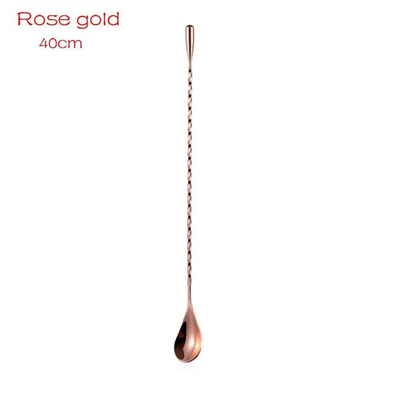 a close up of a spoon with a rose gold handle