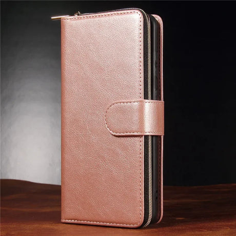 Rose gold leather wallet-style phone case with a zipper and snap closure.