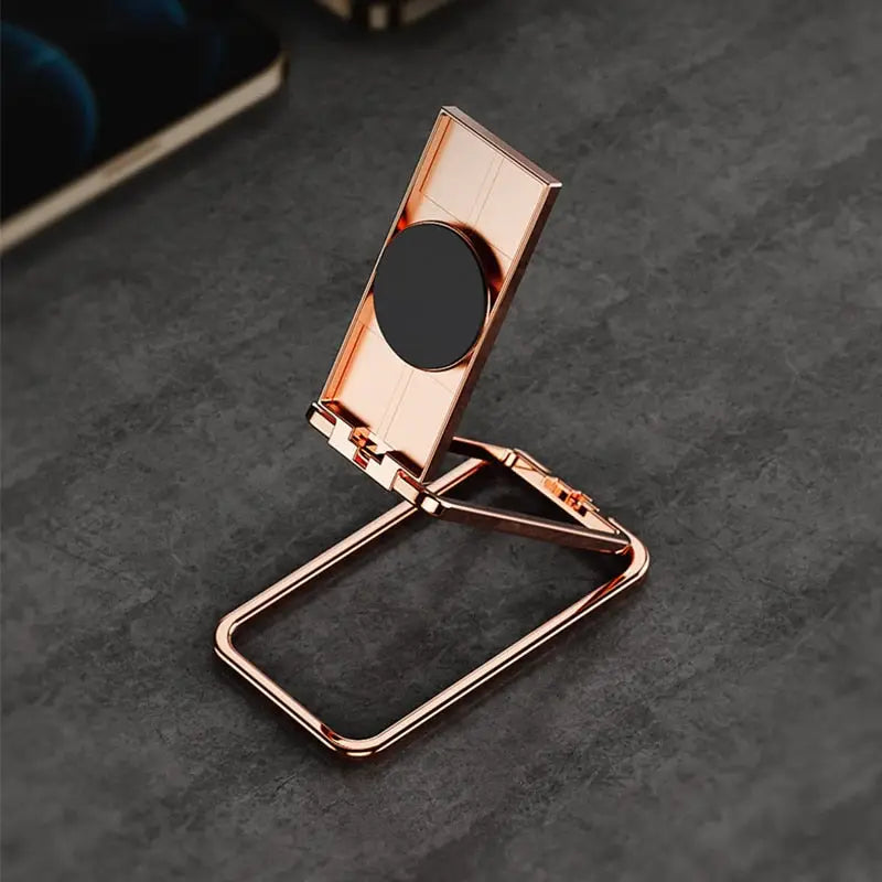 a phone stand with a black circle on top