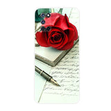 a red rose and a pen on a white background