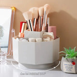 a white desk with a mirror and makeup brushes
