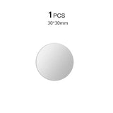 a round mirror with a white background